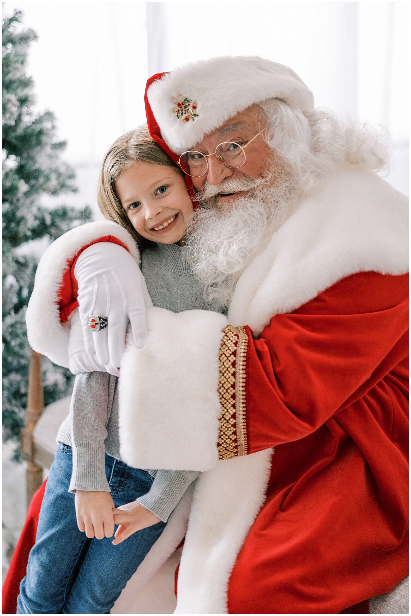 girl giving Santa a hug