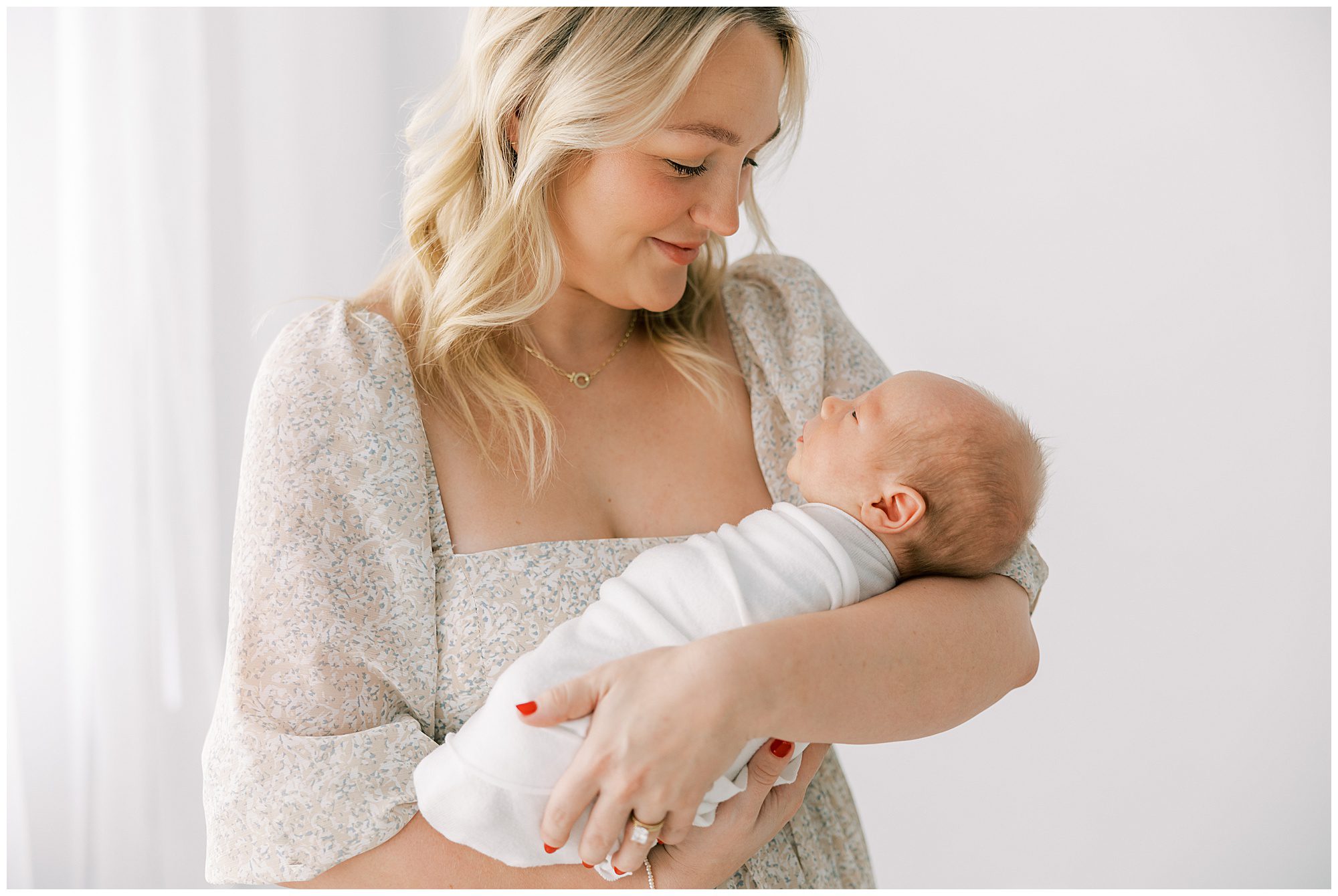mom holding baby at natural knoxville newborn session