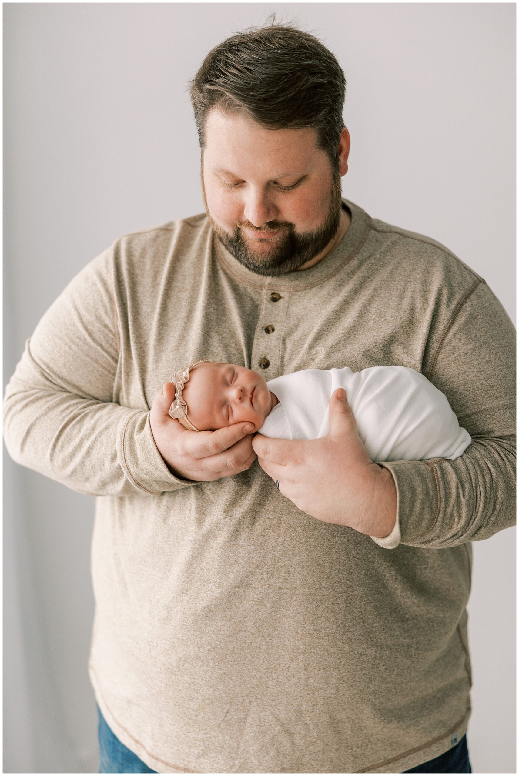 dad holding baby daughter