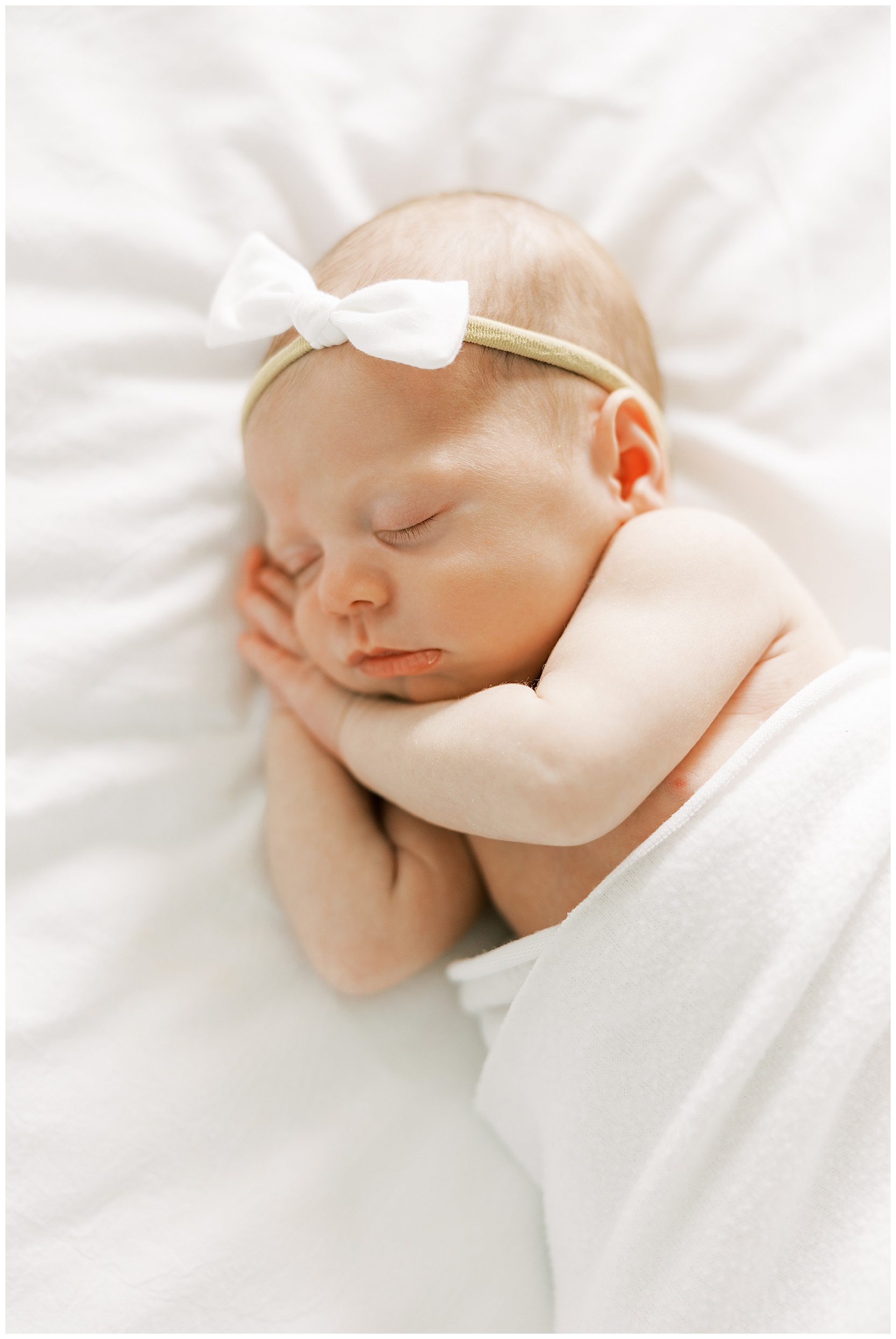 newborn posed on bed