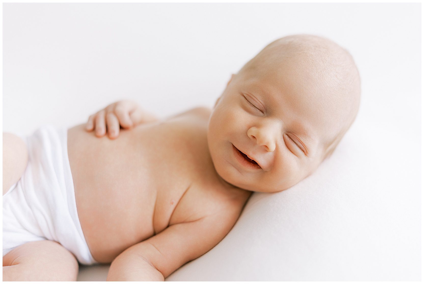 smiling newborn baby