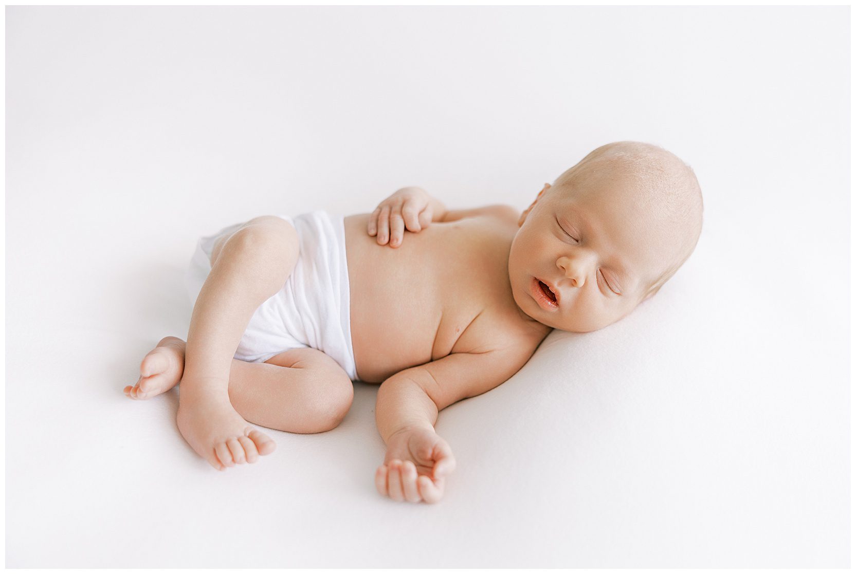 sleeping baby posed on beanbag