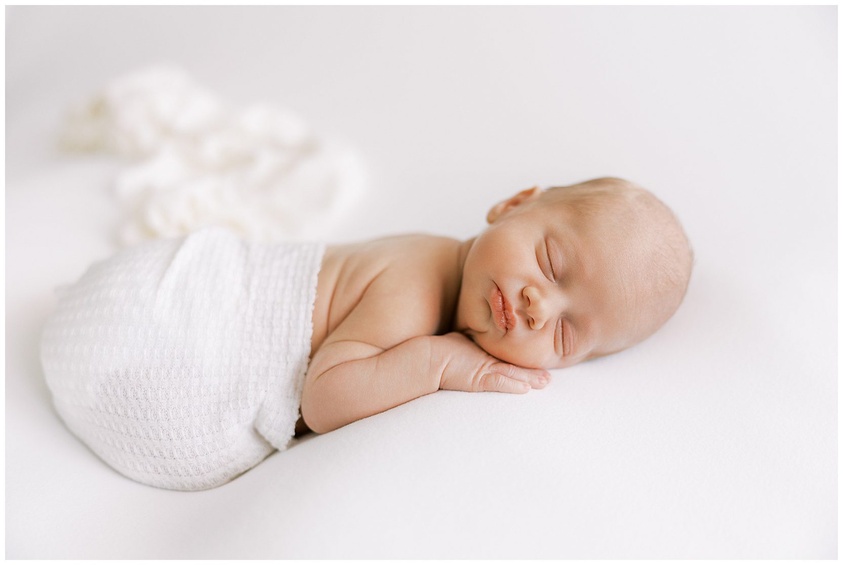 sleeping baby posed on beanbag