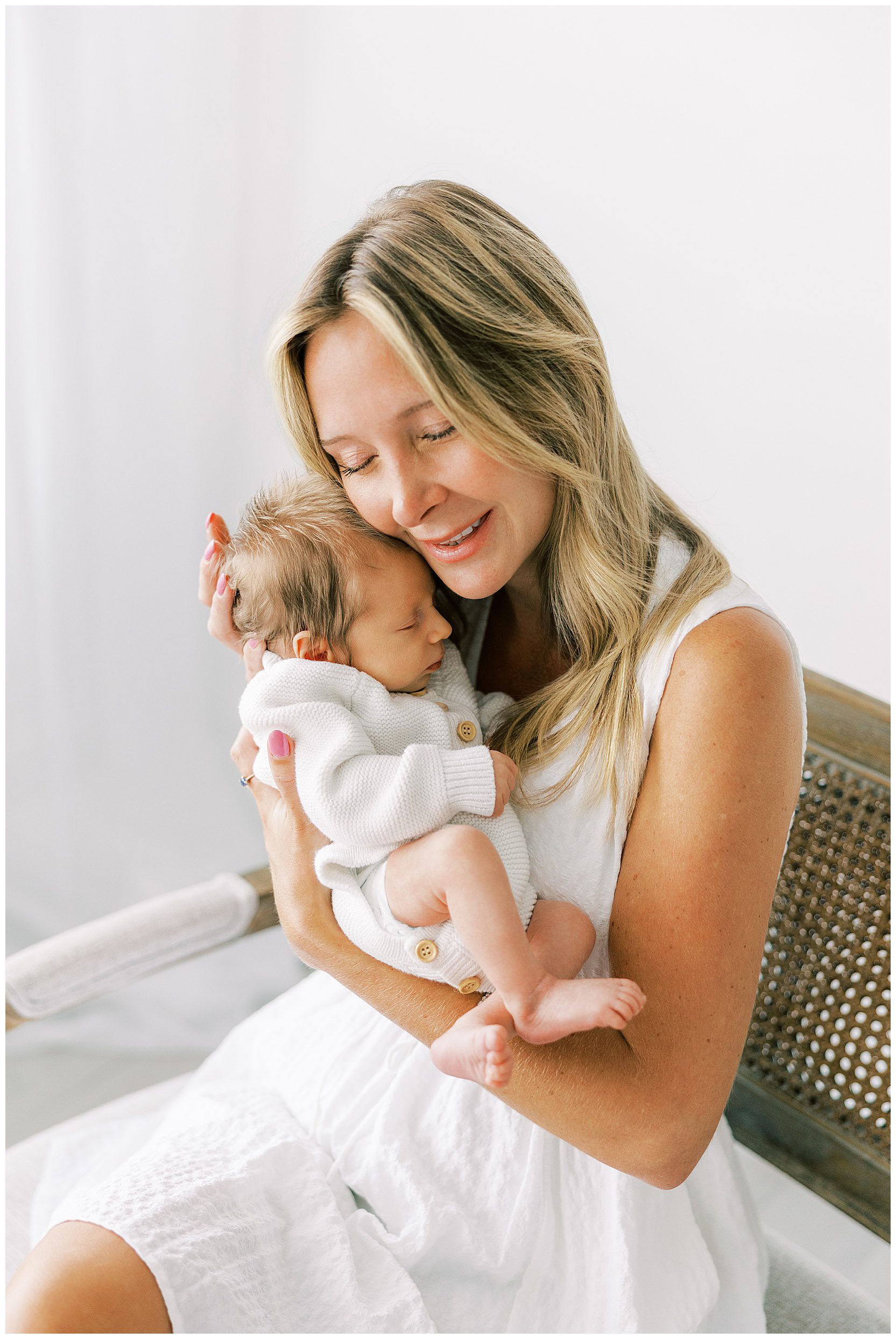 mom holding sleepy baby