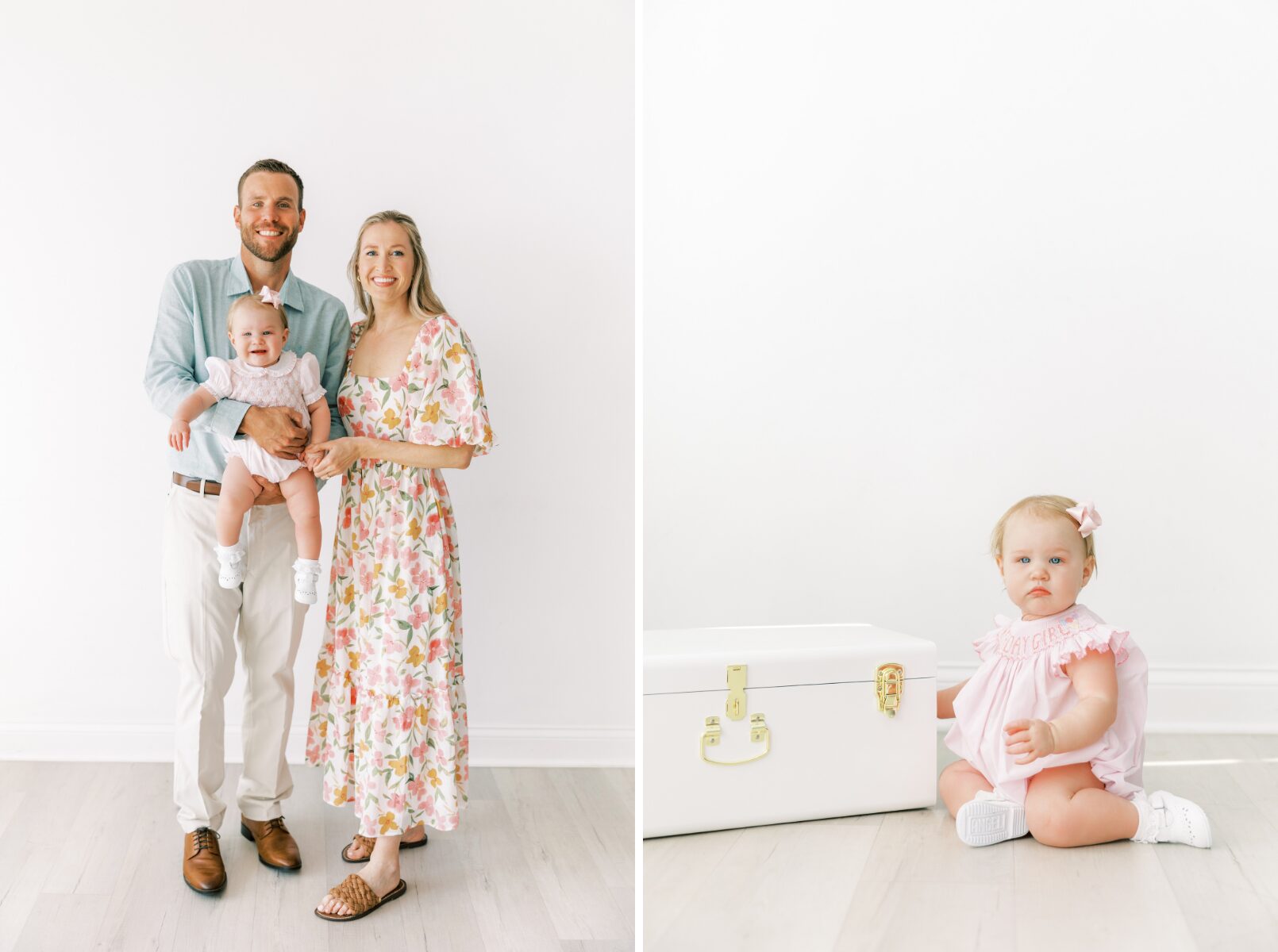 family standing smiling at camera baby with white box