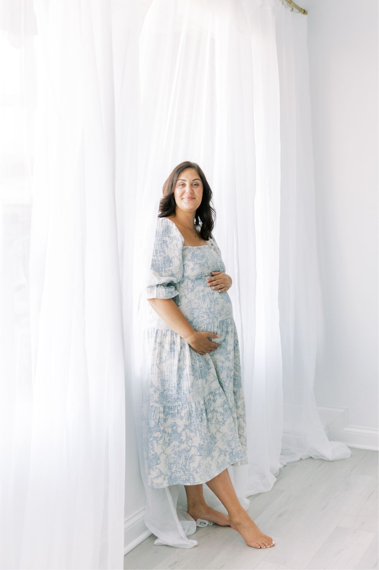 pregnant mother looking at camera