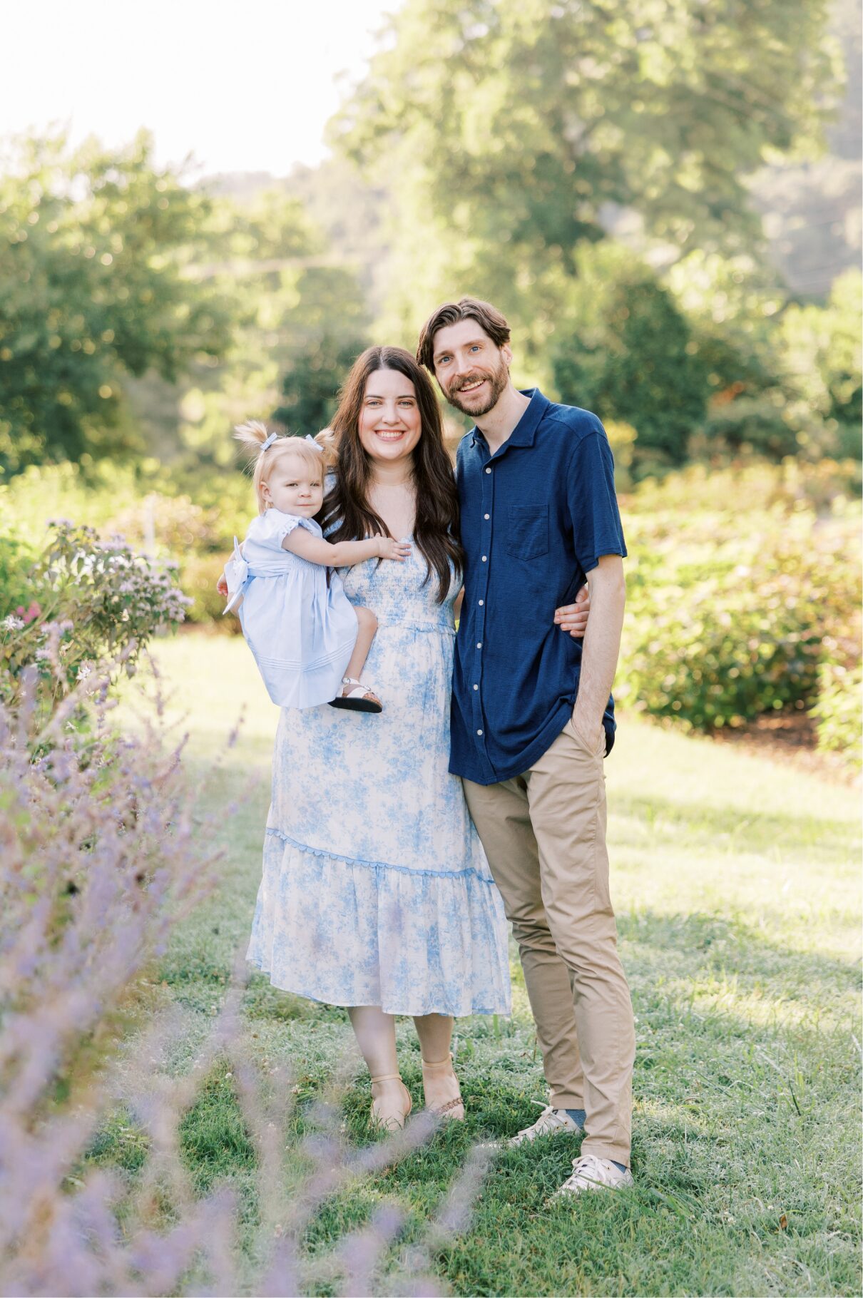 family smiling at camera