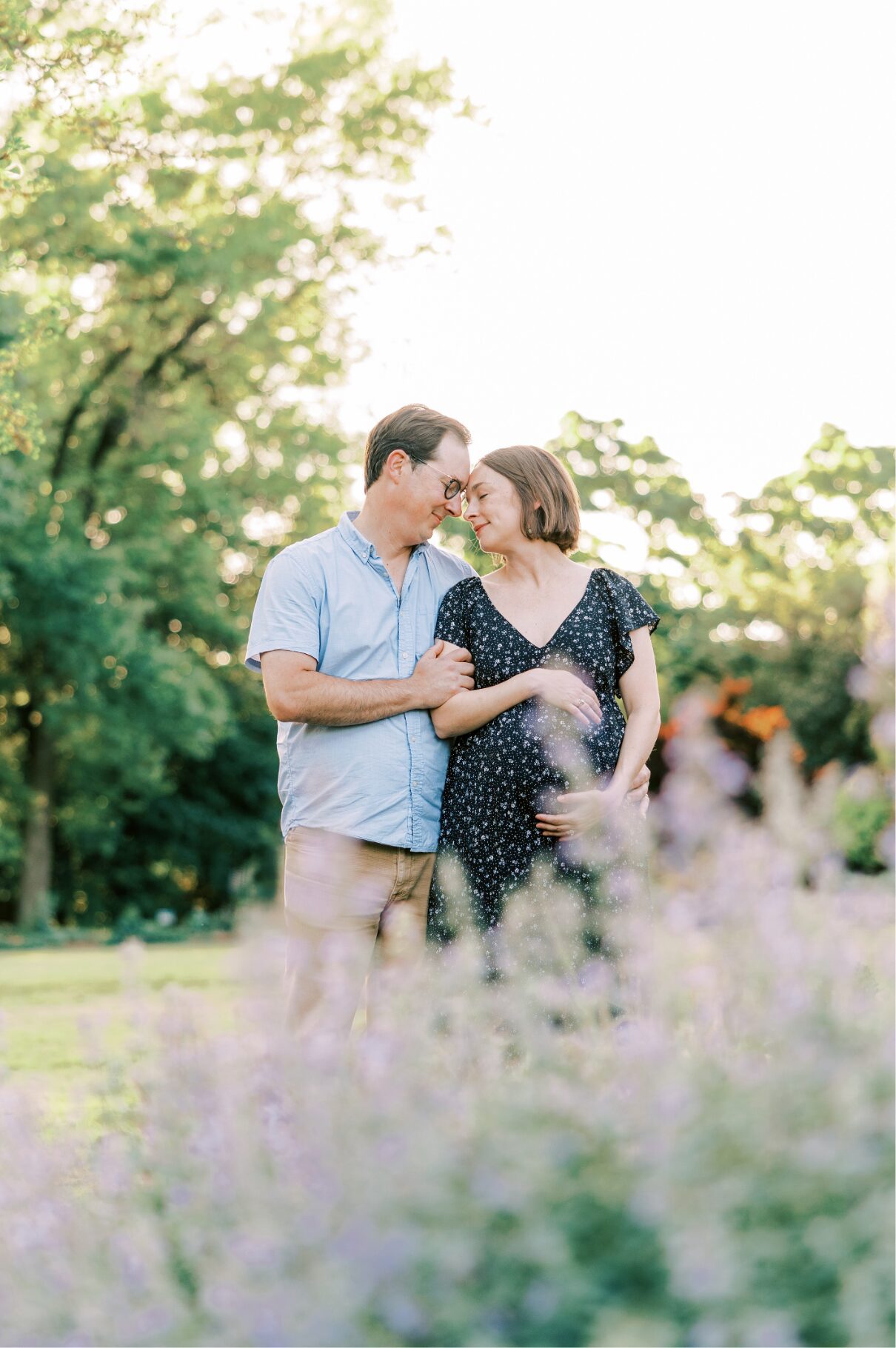 couple looking at each other, taken through the flowers