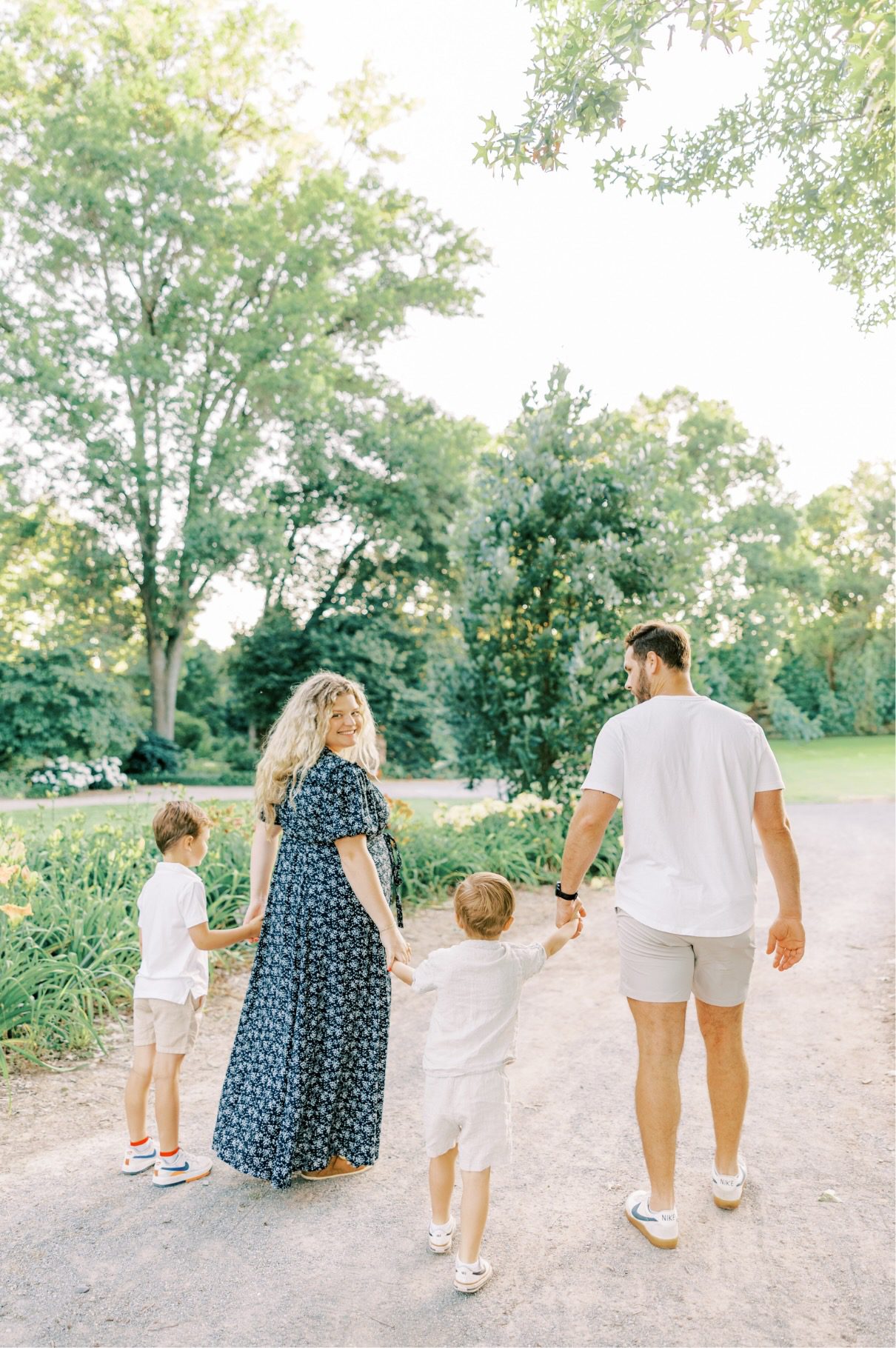 family walking away holding hands